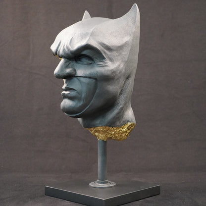 Shadow Knight – Matt Black Gilded, front-right three-quarter view. Matte black bust with gilded fractures exposing skeletal anatomy beneath the surface.
