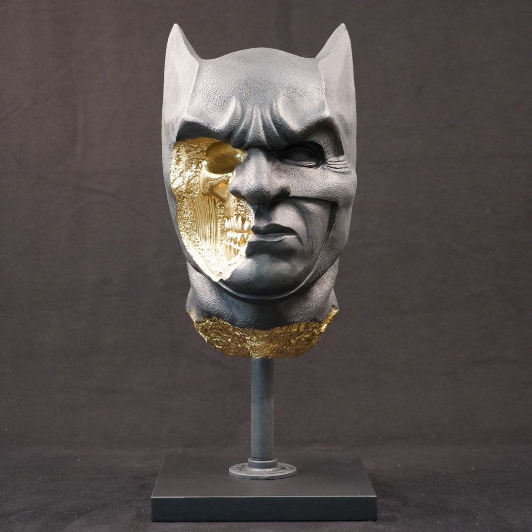 Shadow Knight – Matte Black Gilded, front view. Matte black sculptural bust with gilded fractured sections revealing skeletal anatomy beneath the surface.