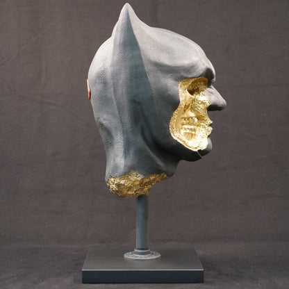 Shadow Knight – Matt Black Gilded, left side view. Sculptural matte black bust with textured surfaces and gilded fracture elements.