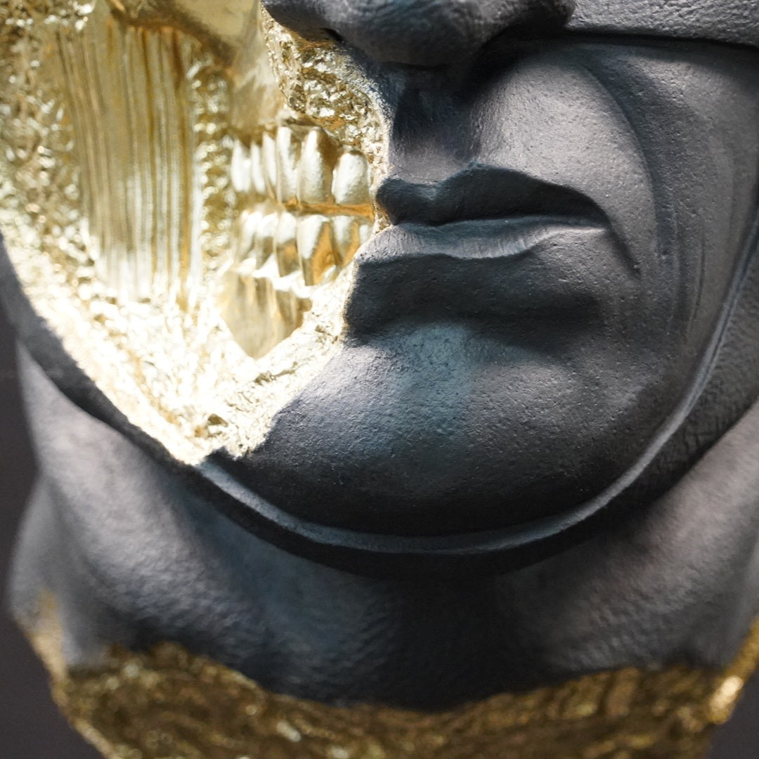 Shadow Knight – Matte Black Gilded, close-up of the mouth and exposed skull. Detailed view of the gilded fracture revealing skeletal teeth and anatomical textures beneath the matte black surface.