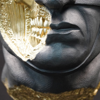 Shadow Knight – Matte Black Gilded, close-up of the mouth and exposed skull. Detailed view of the gilded fracture revealing skeletal teeth and anatomical textures beneath the matte black surface.
